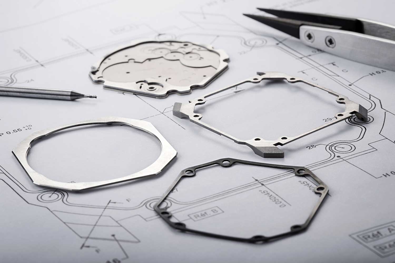 The Octo Finissimo Ultra’s full titanium case dismantled into its component parts. Clockwise from left: bezel, case back which doubles up as the main plate, case-middle with lugs, bezel gasket
