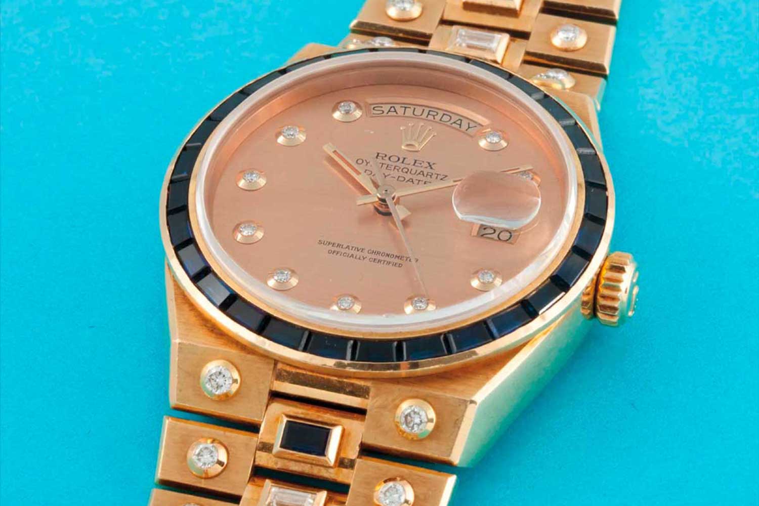 A Rolex Day-Date Oysterquartz ref. 19168 in 18k yellow gold, decorated with diamonds and sapphires; sold on 9 May 2015 for CHF93,750 (Image: Phillips)